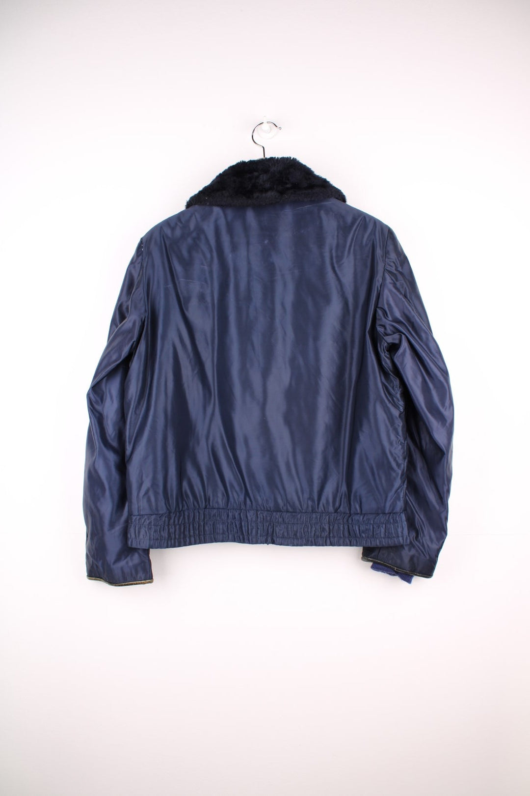 70s Gerber 'Car-Duty' bomber jacket in navy blue - quilt-lined, with a faux fur collar, gold buttons, and four pockets. 