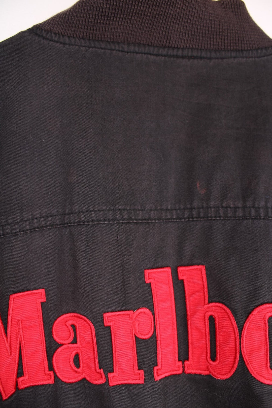 90s Marlboro bomber jacket with pockets, an embroidered spelllout on the back and zip closure. 