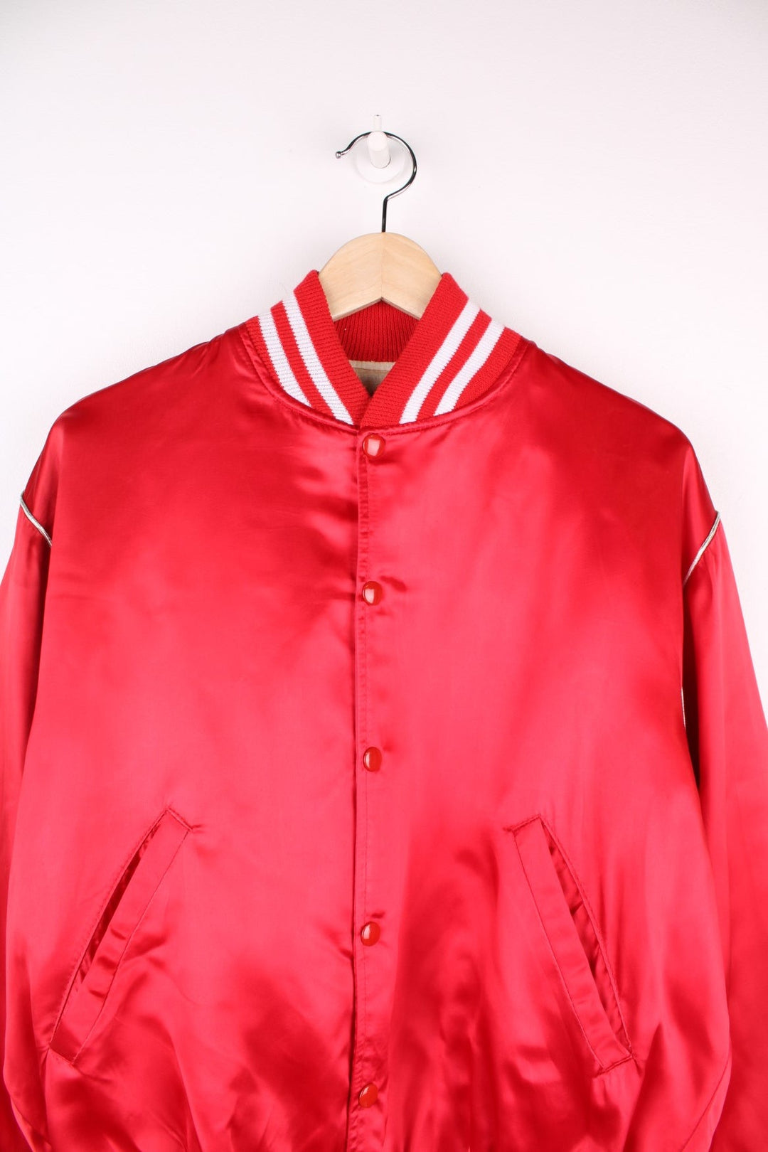 Happy Together Tour 1984 Varsity Jacket, this iconic tour featured the bands Gary Puckett, The Association, Spanky McFarlane and The Turtles. Is in a red and white colourway, buttons up with side pockets and has the spell out logo embroidered on the back.