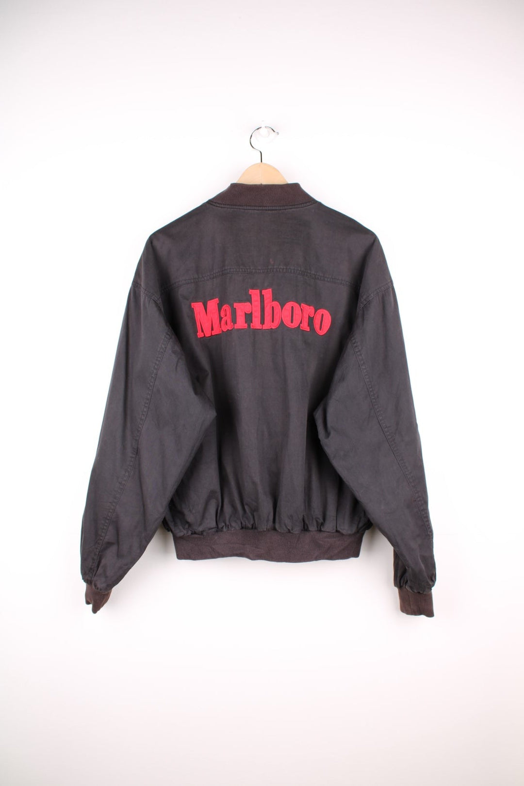 90s Marlboro bomber jacket with pockets, an embroidered spelllout on the back and zip closure. 