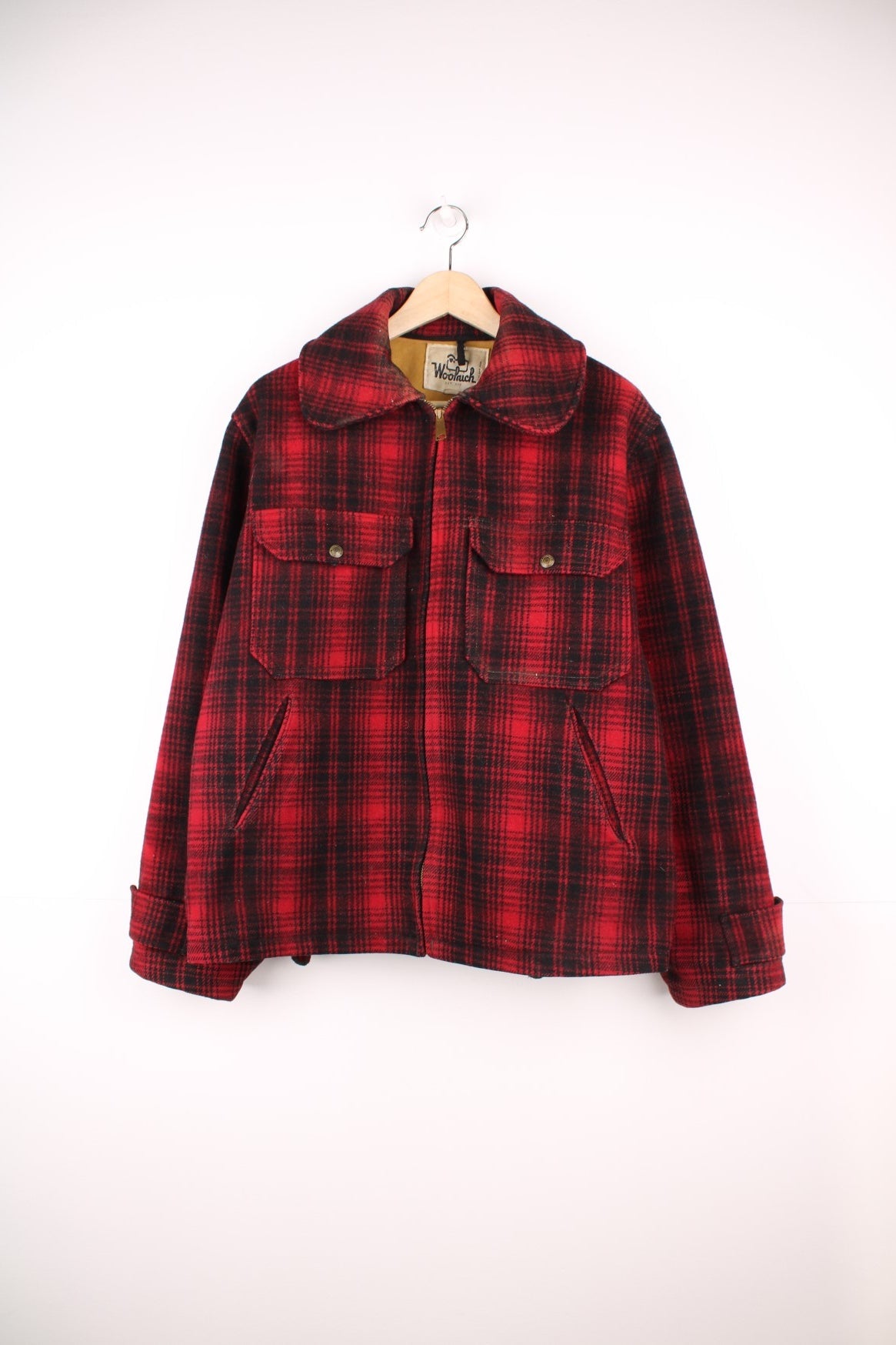 Woolrich red and black check CPO jacket with zip closure and four pockets. 