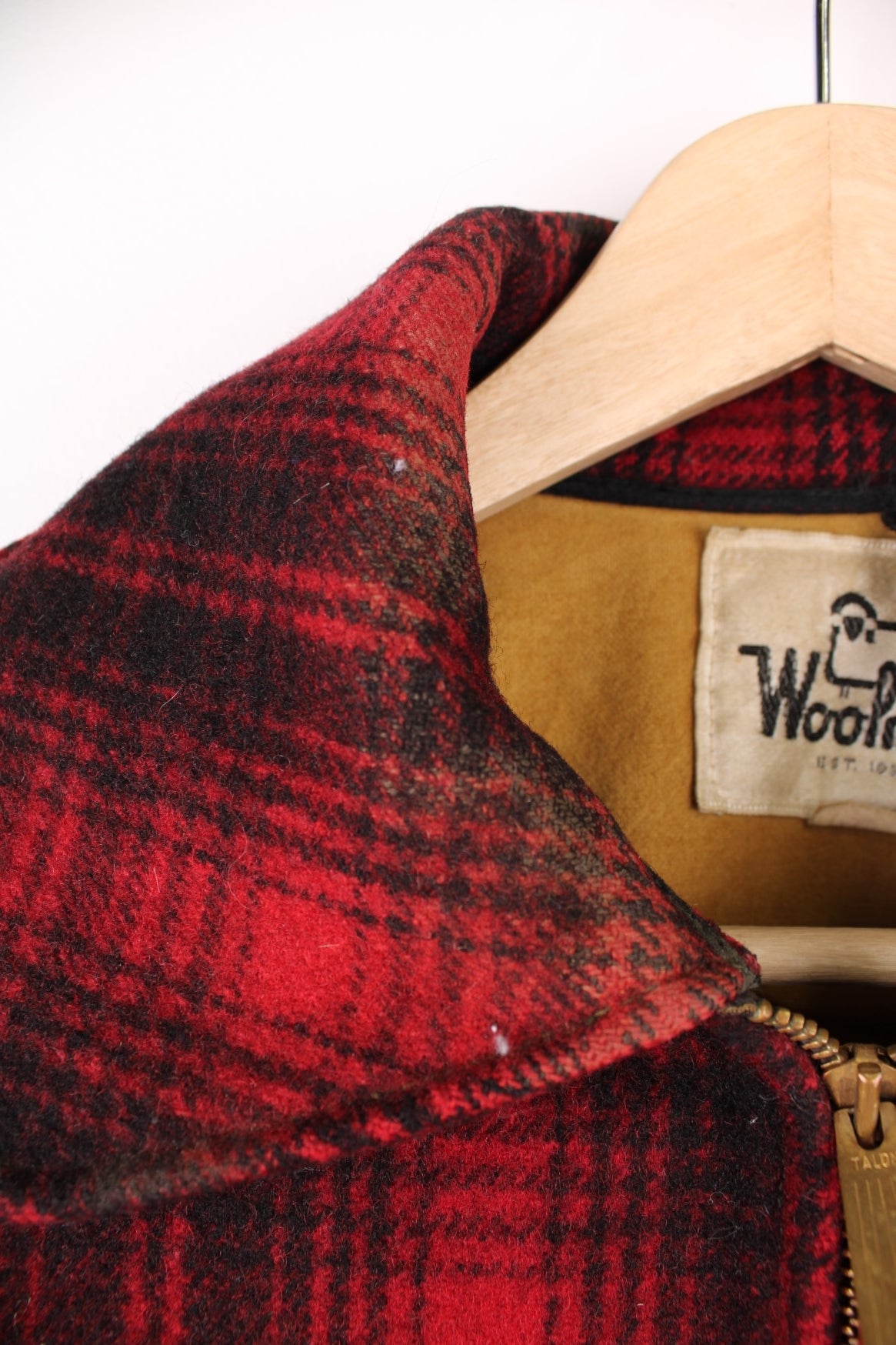 Woolrich red and black check CPO jacket with zip closure and four pockets. 