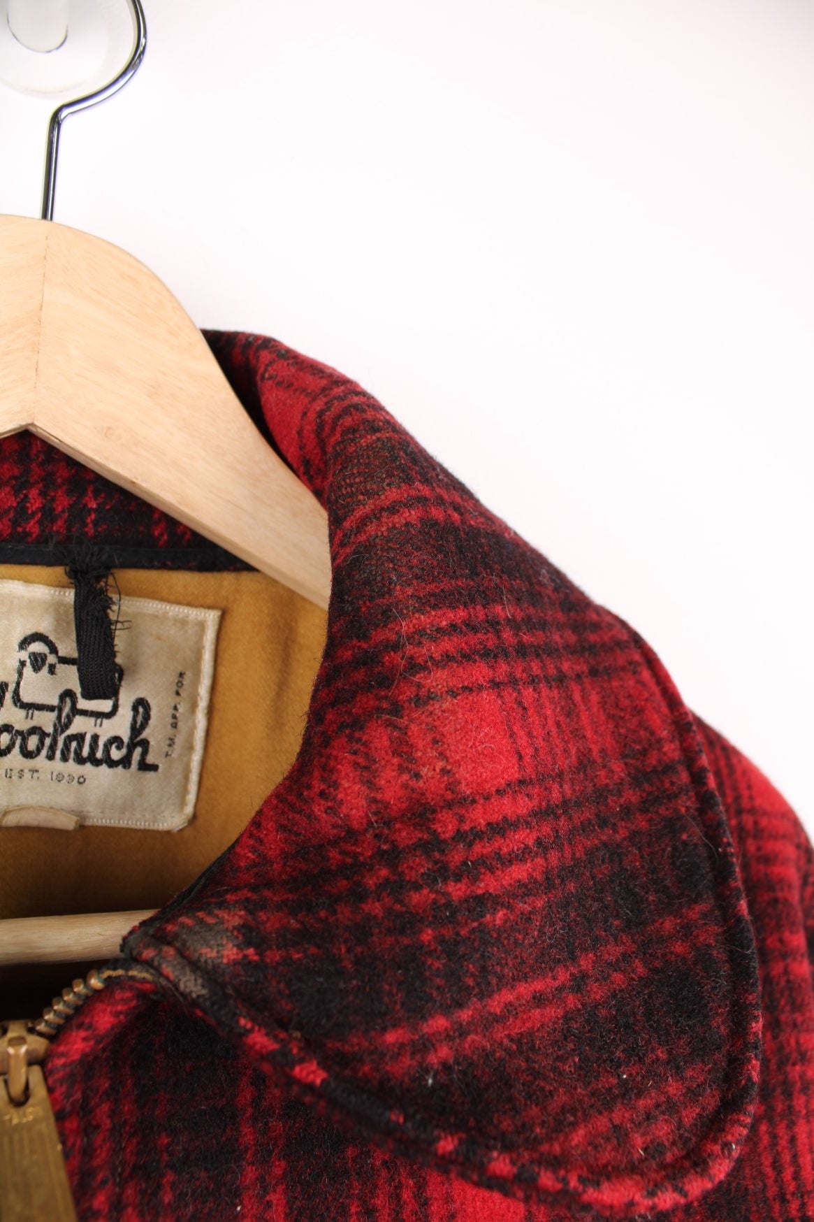 Woolrich red and black check CPO jacket with zip closure and four pockets. 