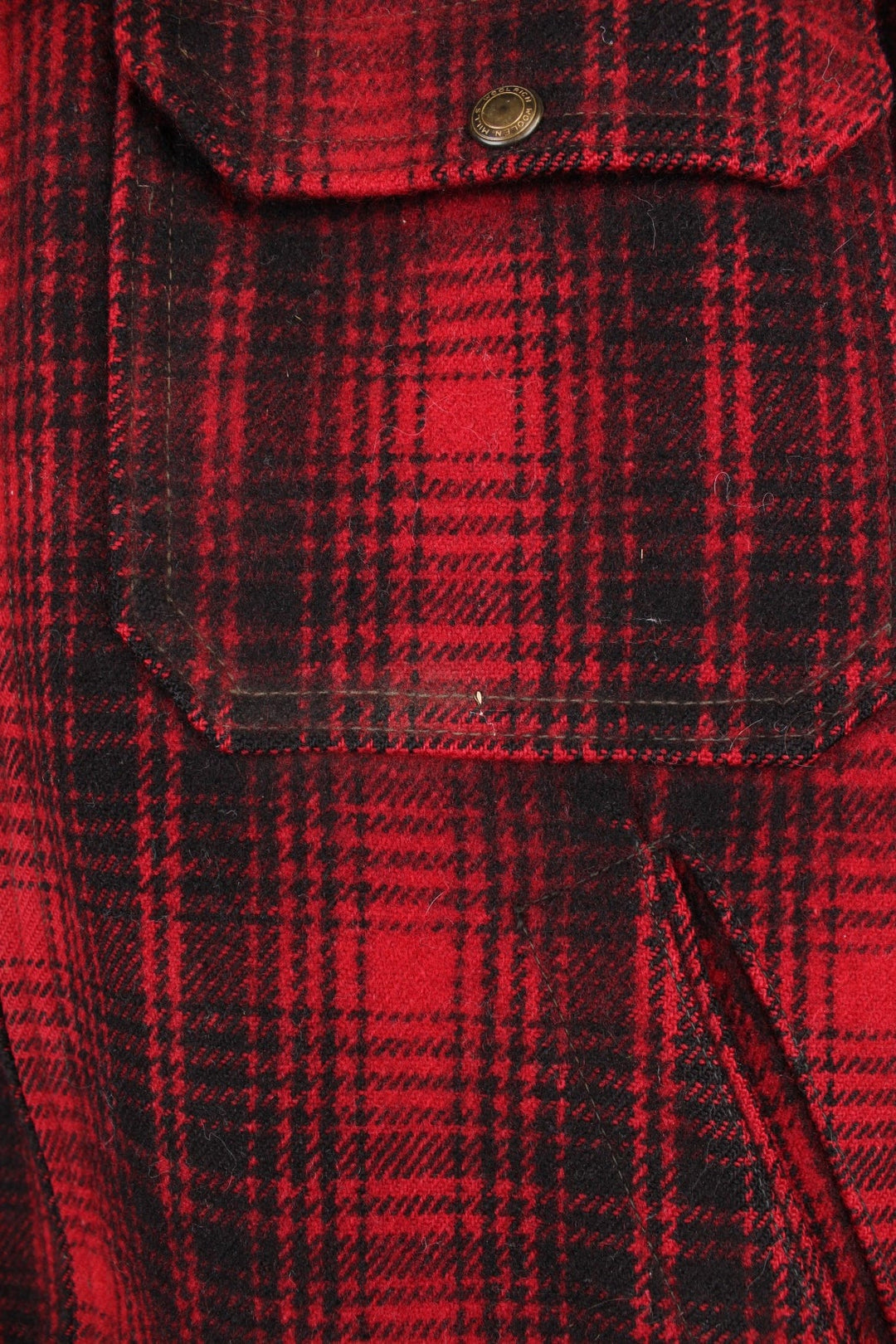 Woolrich red and black check CPO jacket with zip closure and four pockets. 