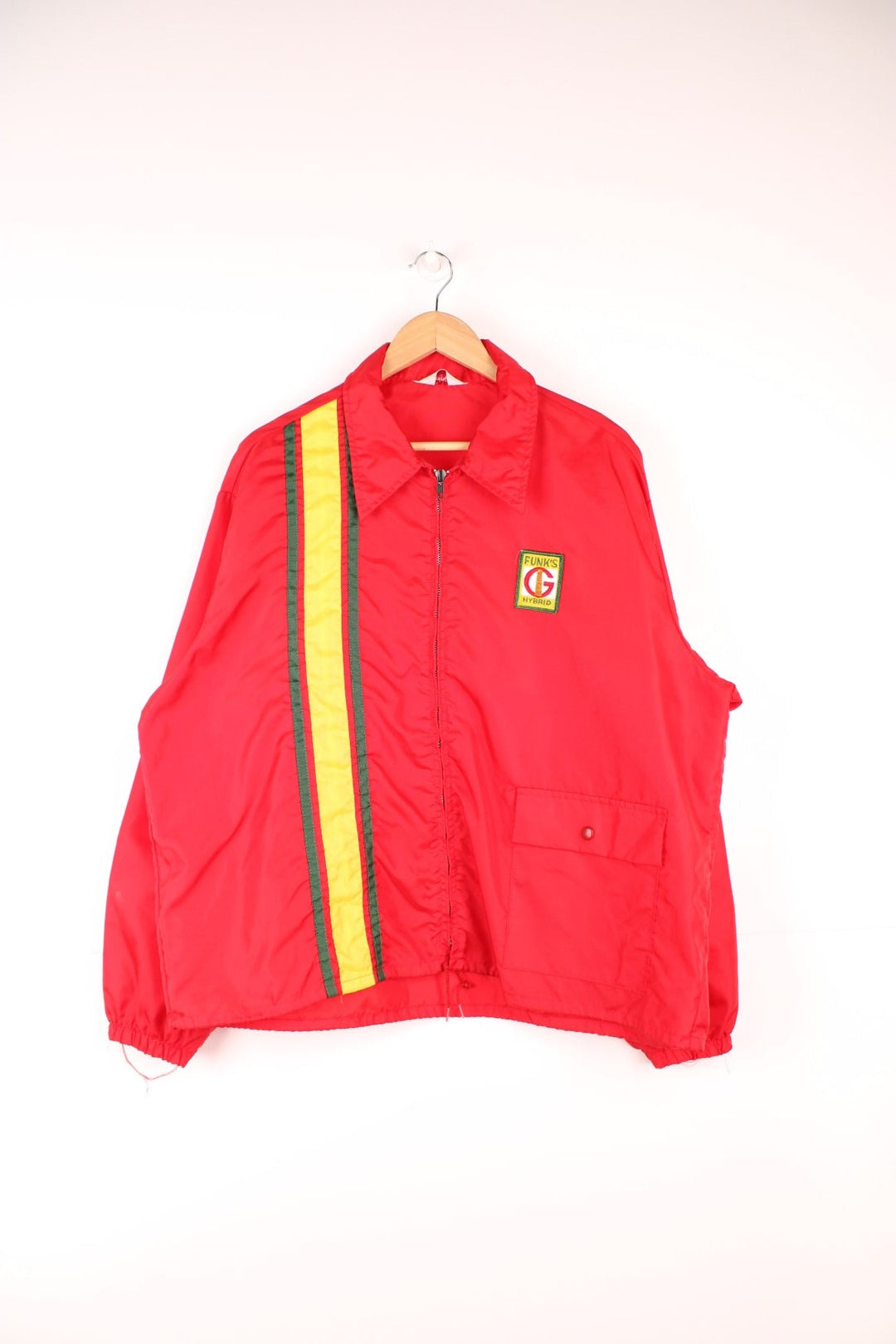 Vintage 1970's Funk's Hybrid Corn striped windbreaker/coach style jacket in red by Swingster. Features full zip and embroidered badge