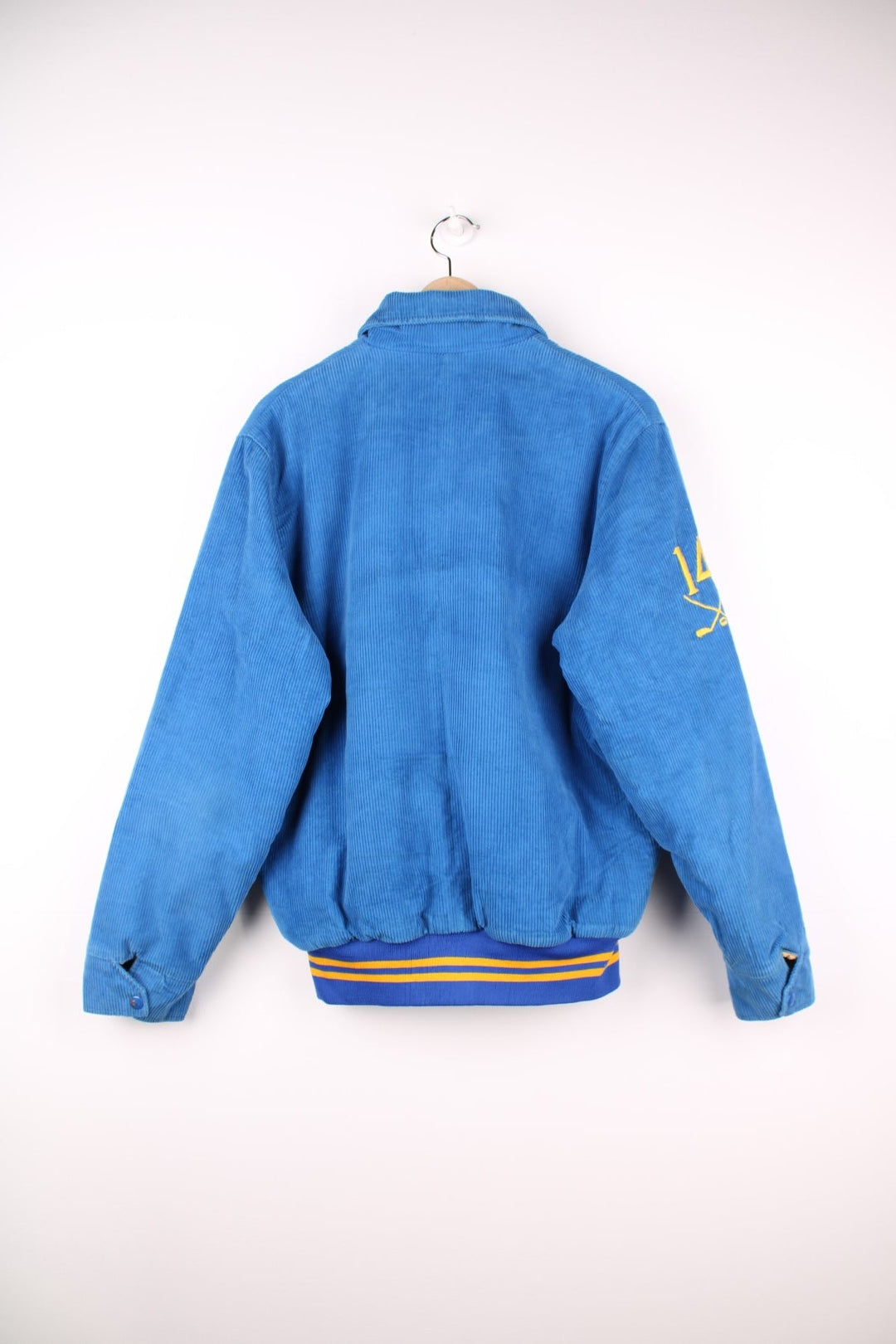 Vintage 80's Oshawa Firefighters Corduroy Varsity Jacket in a blue and yellow colourway, buttons up and has side pockets, insulated with a quilted lining, and has the logos embroidered on the front and right sleeve.