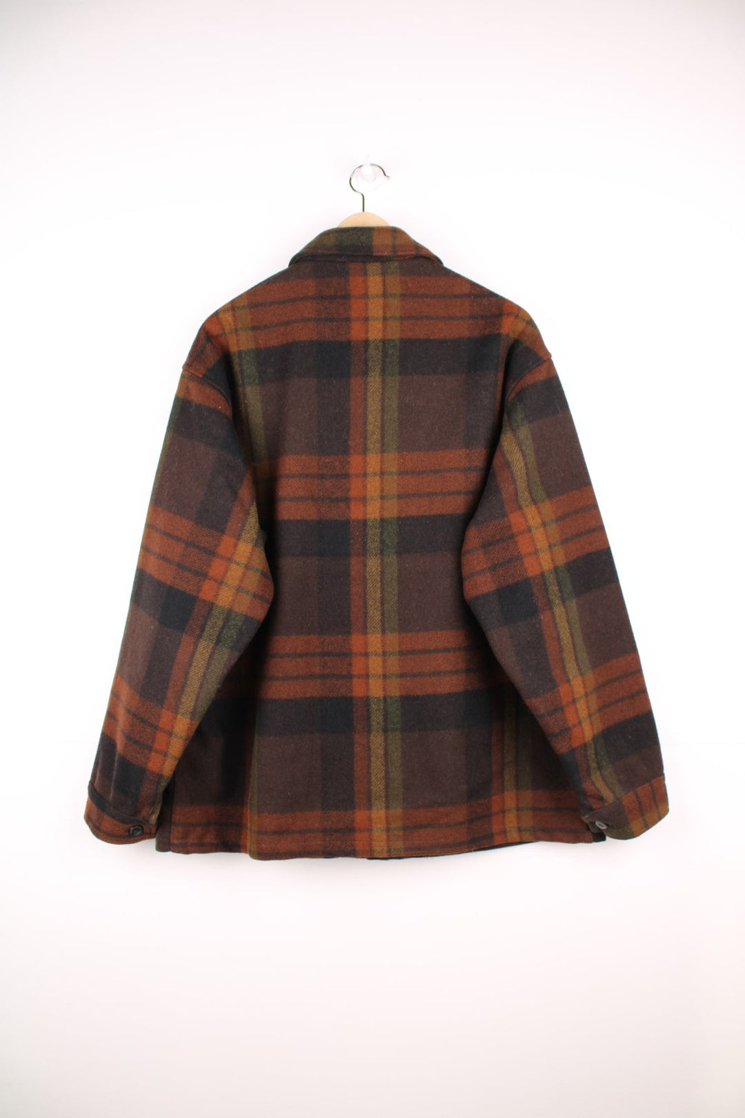 Pendleton brown plaid CPO jacket with two flap pockets and button closure. 