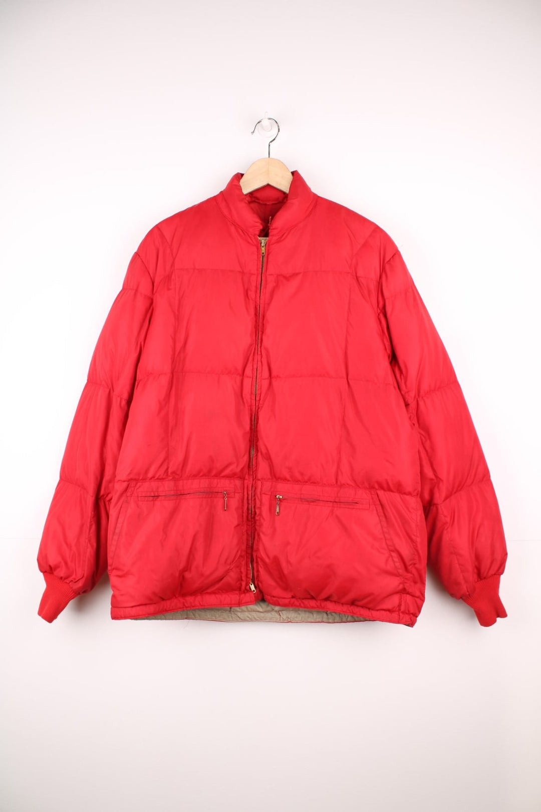 Red Bauer Down hooded puffer jacket with two pockets and zip closure. 