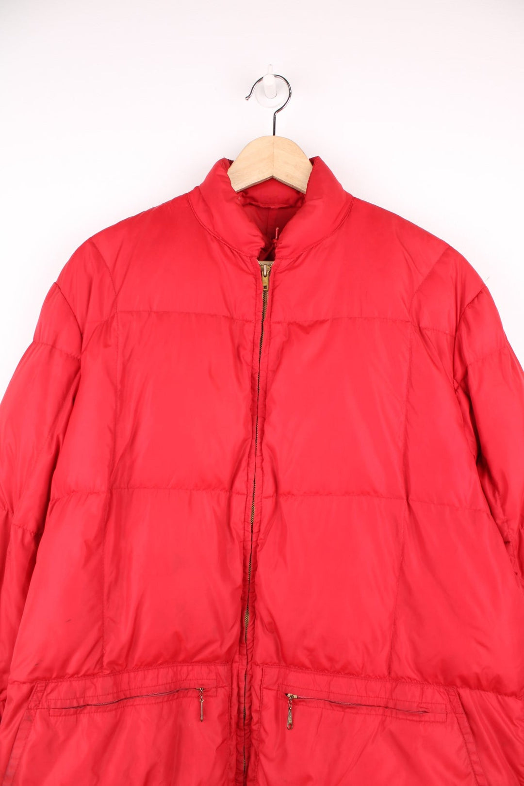 Red Bauer Down hooded puffer jacket with two pockets and zip closure. 