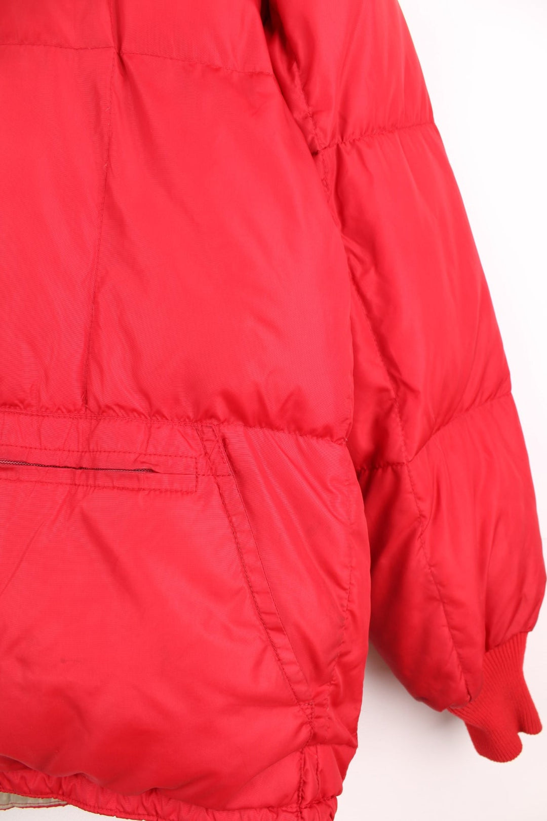 Red Bauer Down hooded puffer jacket with two pockets and zip closure. 