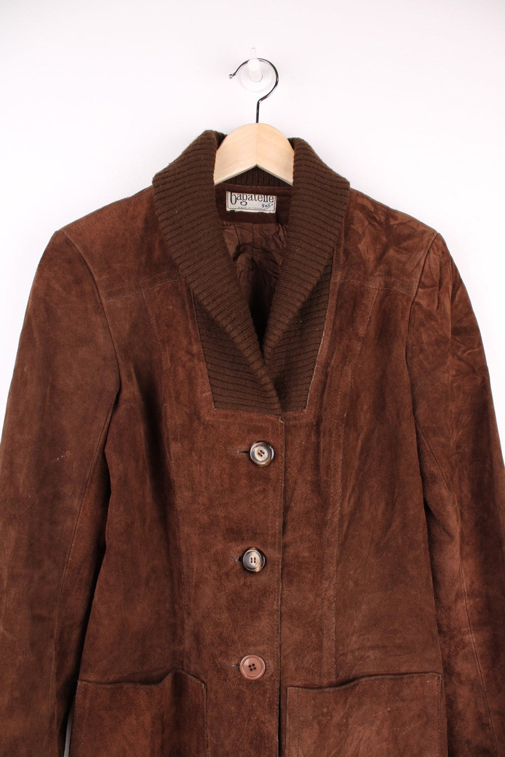 Vintage 80's Bagatelle Leather Coat in a brown colourway, buttons up and has double pockets on the front. 