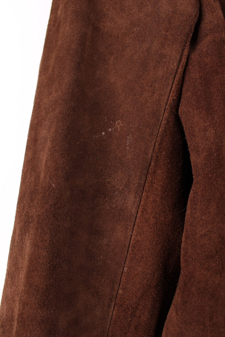 Vintage 80's Bagatelle Leather Coat in a brown colourway, buttons up and has double pockets on the front. 