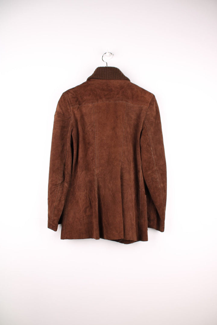 Vintage 80's Bagatelle Leather Coat in a brown colourway, buttons up and has double pockets on the front. 