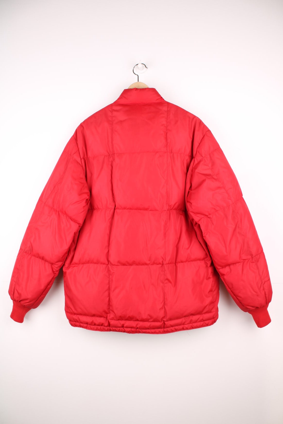 Red Bauer Down hooded puffer jacket with two pockets and zip closure. 