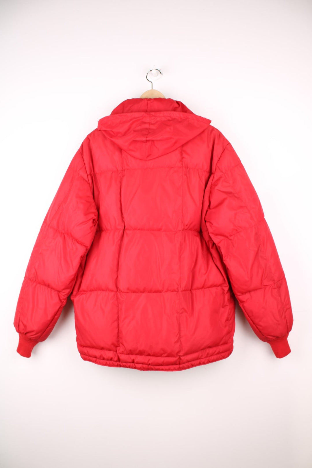 Red Bauer Down hooded puffer jacket with two pockets and zip closure. 