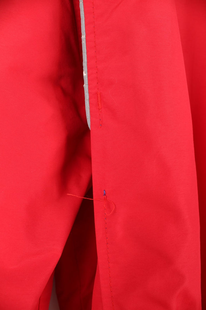 Crown of California bomber jacket in red with snap closure, two pockets and embroidered Budweiser and Bud Light logos on the chest, sleeves and back. 