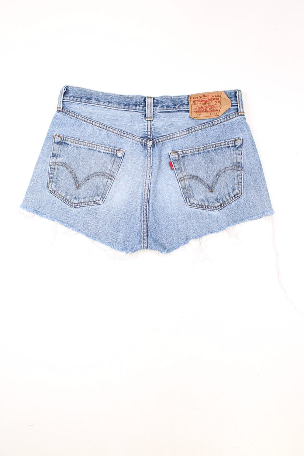 Levi's light blue 501 cutoff shorts with front and back pockets, distressed detailing and Levi's branded hardware.