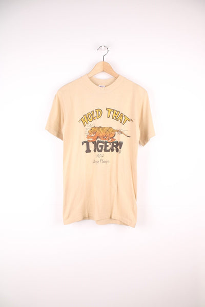 Vintage tan tiger design tee with 'HOLD THAT TIGER! - 1984 League Champs' spellout. 