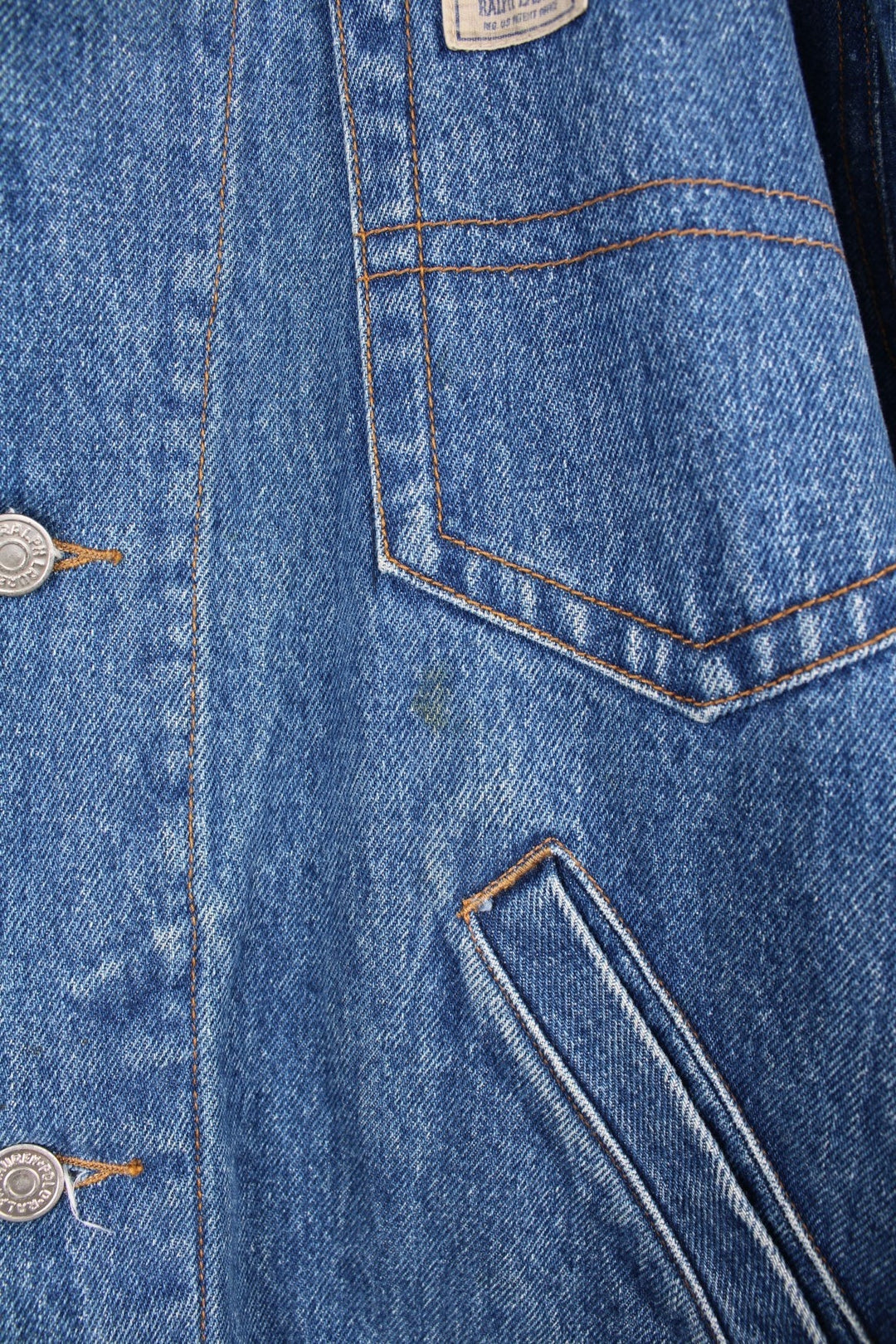 Ralph Lauren Country denim jacket with corduroy collar and applique. Four front pockets, with 'Polo Country' logos on the left breast pocket and the bottom back hem. 