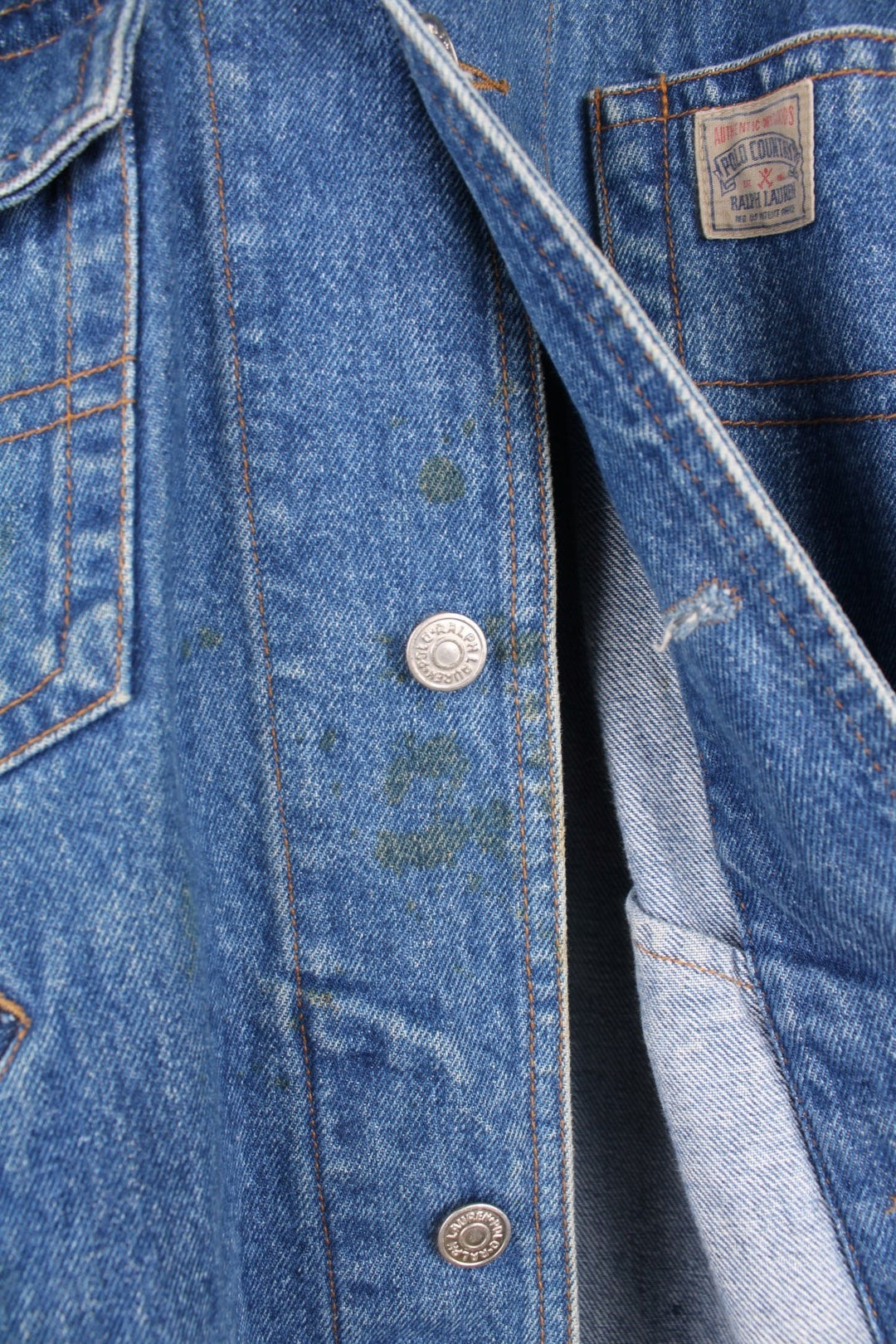 Ralph Lauren Country denim jacket with corduroy collar and applique. Four front pockets, with 'Polo Country' logos on the left breast pocket and the bottom back hem. 