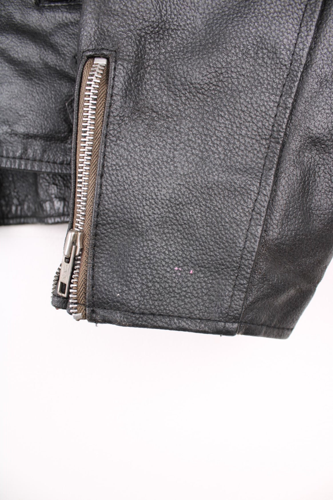 80s Campri Everest black leather biker jacket with four zip pockets and adjustable buckles on the hips.   