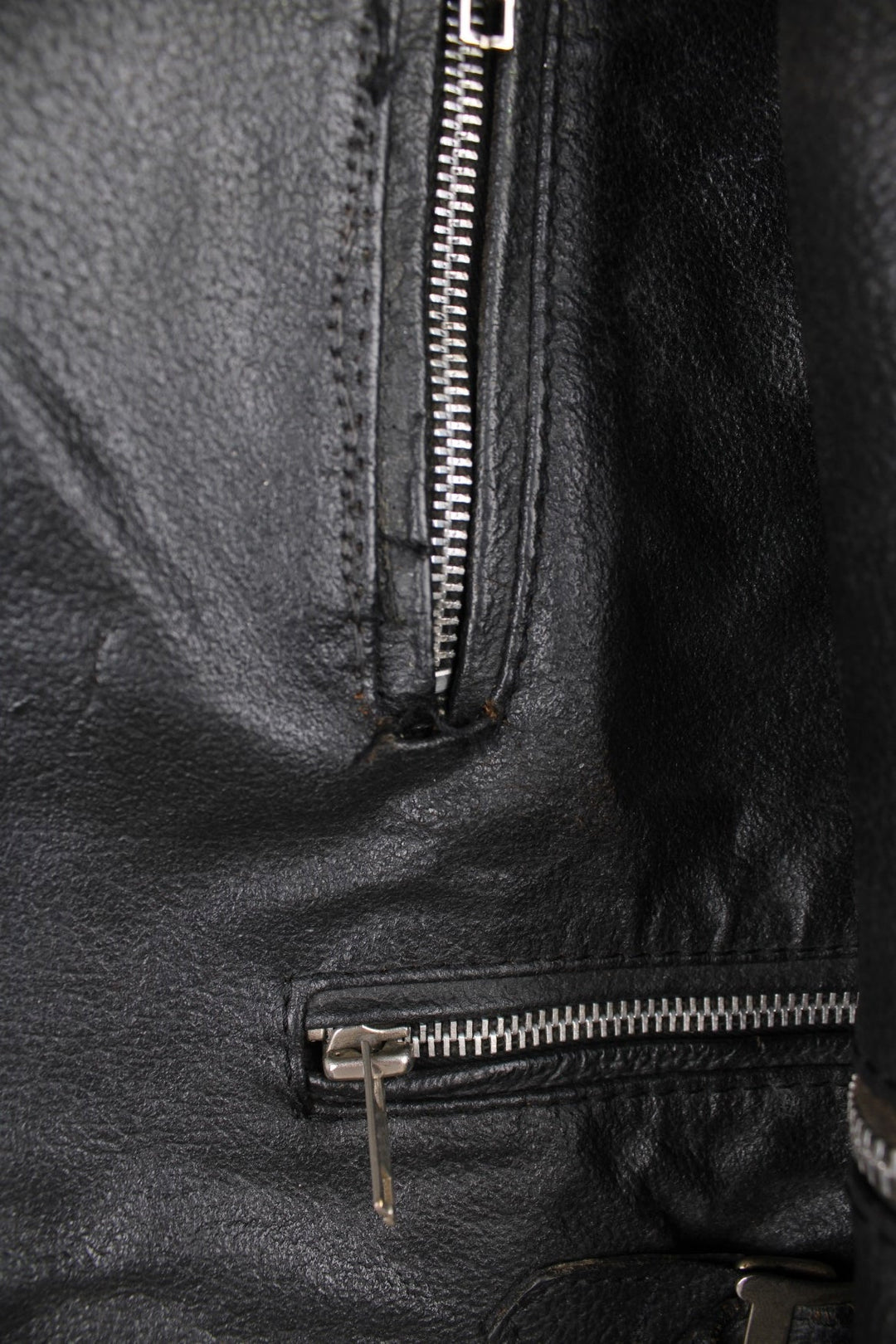 80s Campri Everest black leather biker jacket with four zip pockets and adjustable buckles on the hips.   