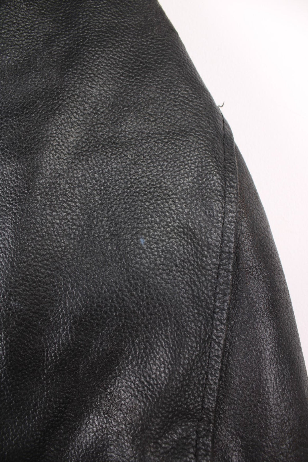 80s Campri Everest black leather biker jacket with four zip pockets and adjustable buckles on the hips.   