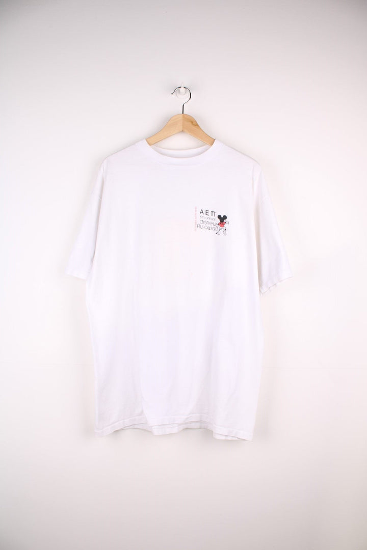 1990 Disney Annual Fly-Away T-Shirt in a white colourway with the logo printed on the chest and on the back a big graphic printed with all the characters and spell out.