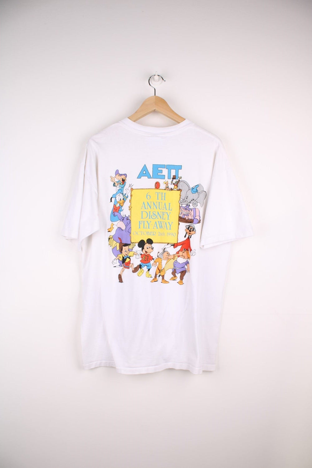 1990  Annual Fly-Away T-Shirt in a  colourway with the logo printed on the chest and on the back a big graphic printed with all the characters and spell out.