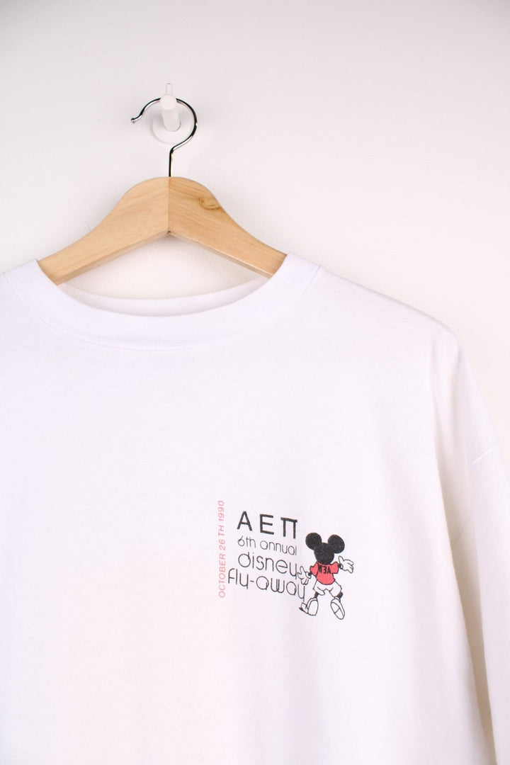 1990  Annual Fly-Away T-Shirt in a  colourway with the logo printed on the chest and on the back a big graphic printed with all the characters and spell out.