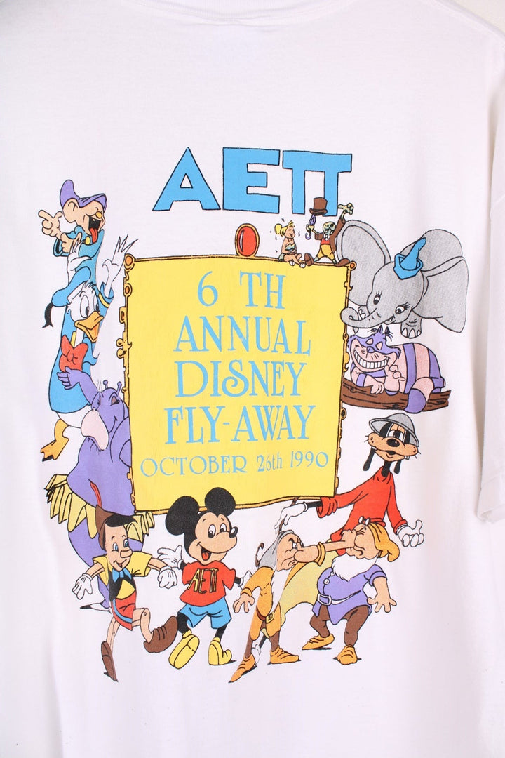 1990  Annual Fly-Away T-Shirt in a  colourway with the logo printed on the chest and on the back a big graphic printed with all the characters and spell out.