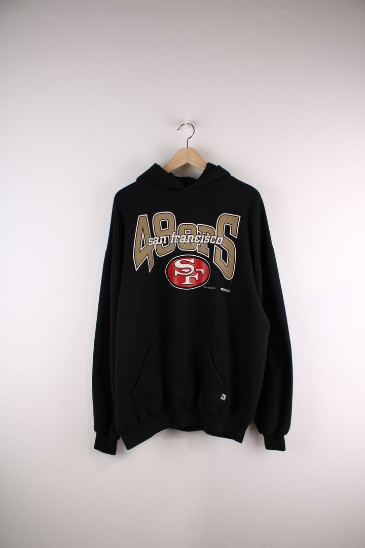 1995 Russell Athletic San Francisco 49ers Hoodie in a black colourway with the logo and spell out printed across the front.