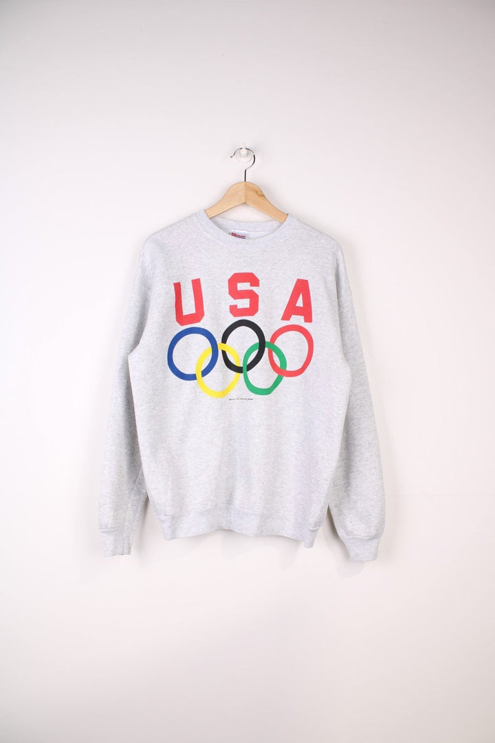 Vintage USA Olynpics Sweatshirt in a grey colourway with the logo and spell out printed across the front.