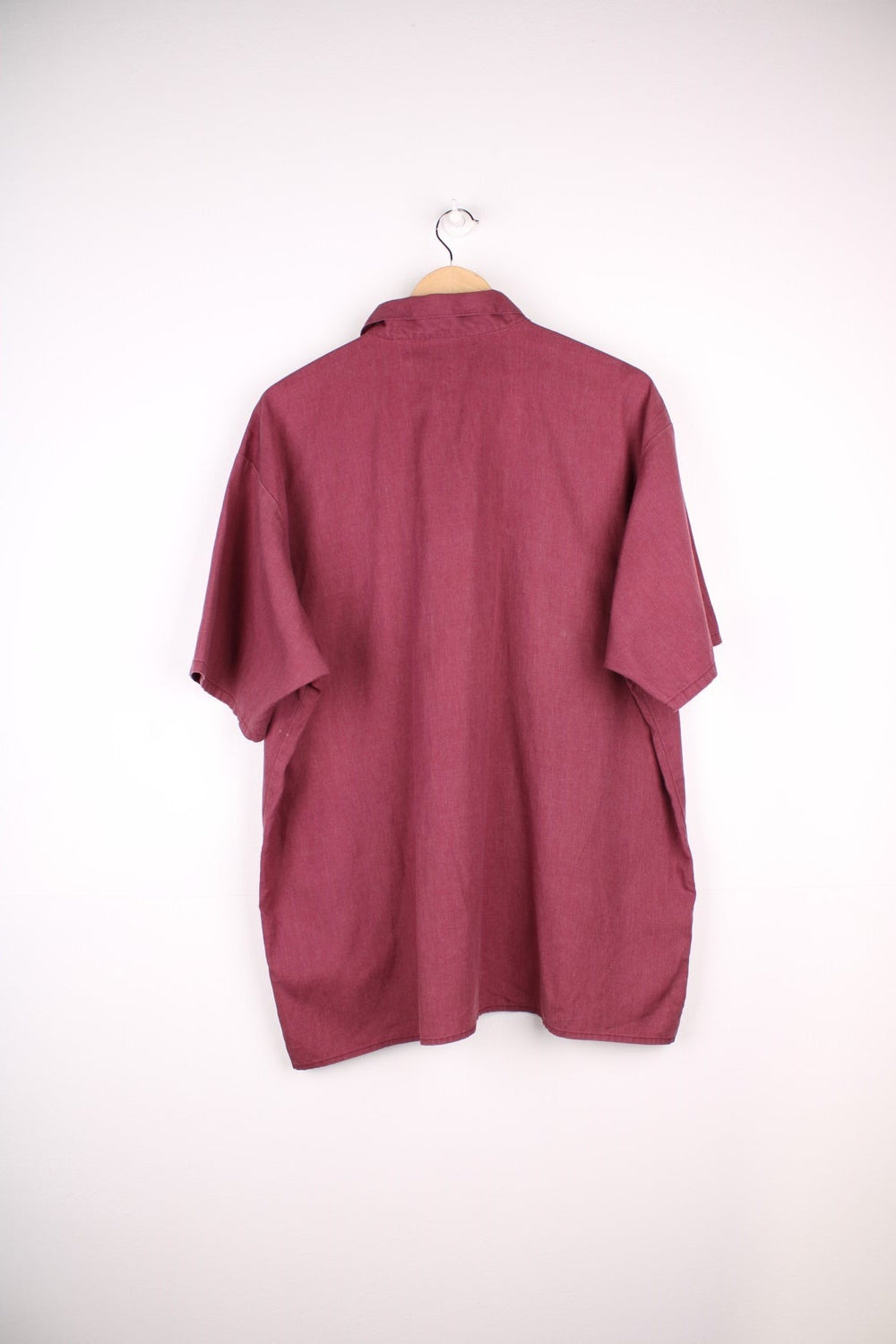  Work Wear Shirt in a burgundy  colourway, zip up half way, has double chest pockets with the logo embroidered on.