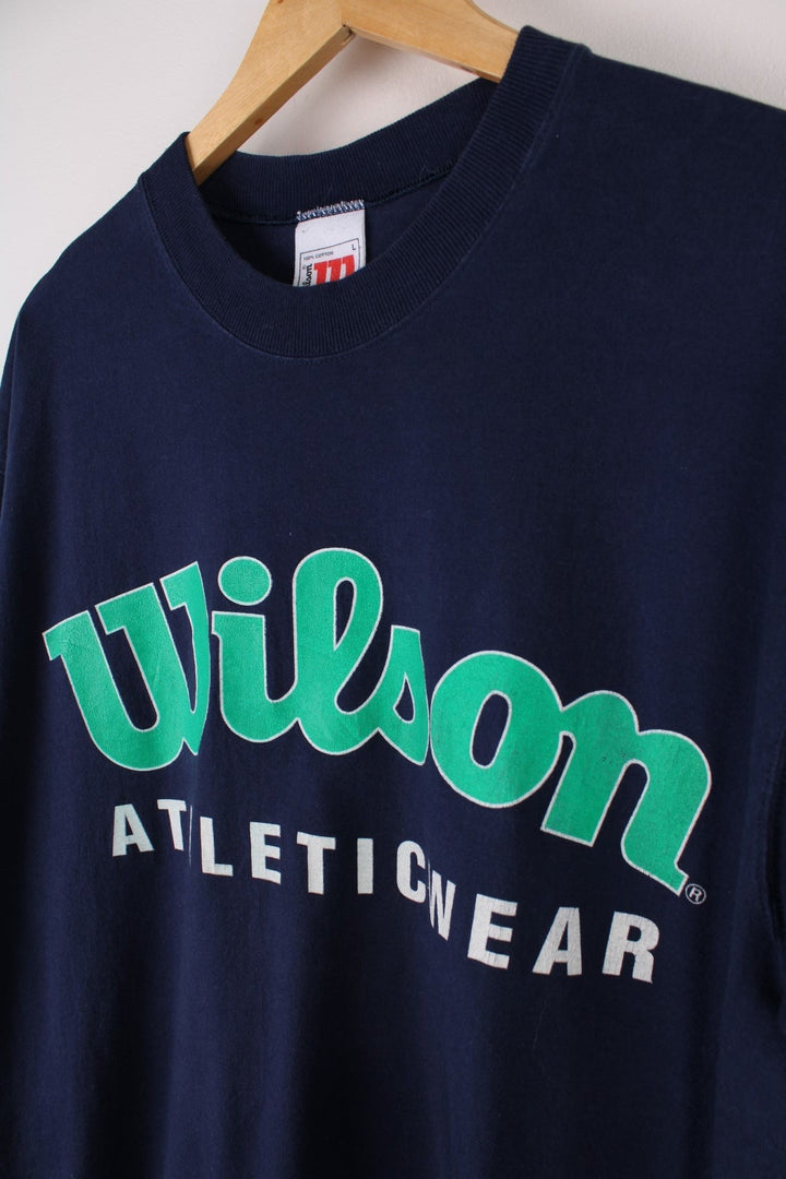 Vintage  Athletic Wear T-Shirt in a  colourway with the spell out logo printed across the front.