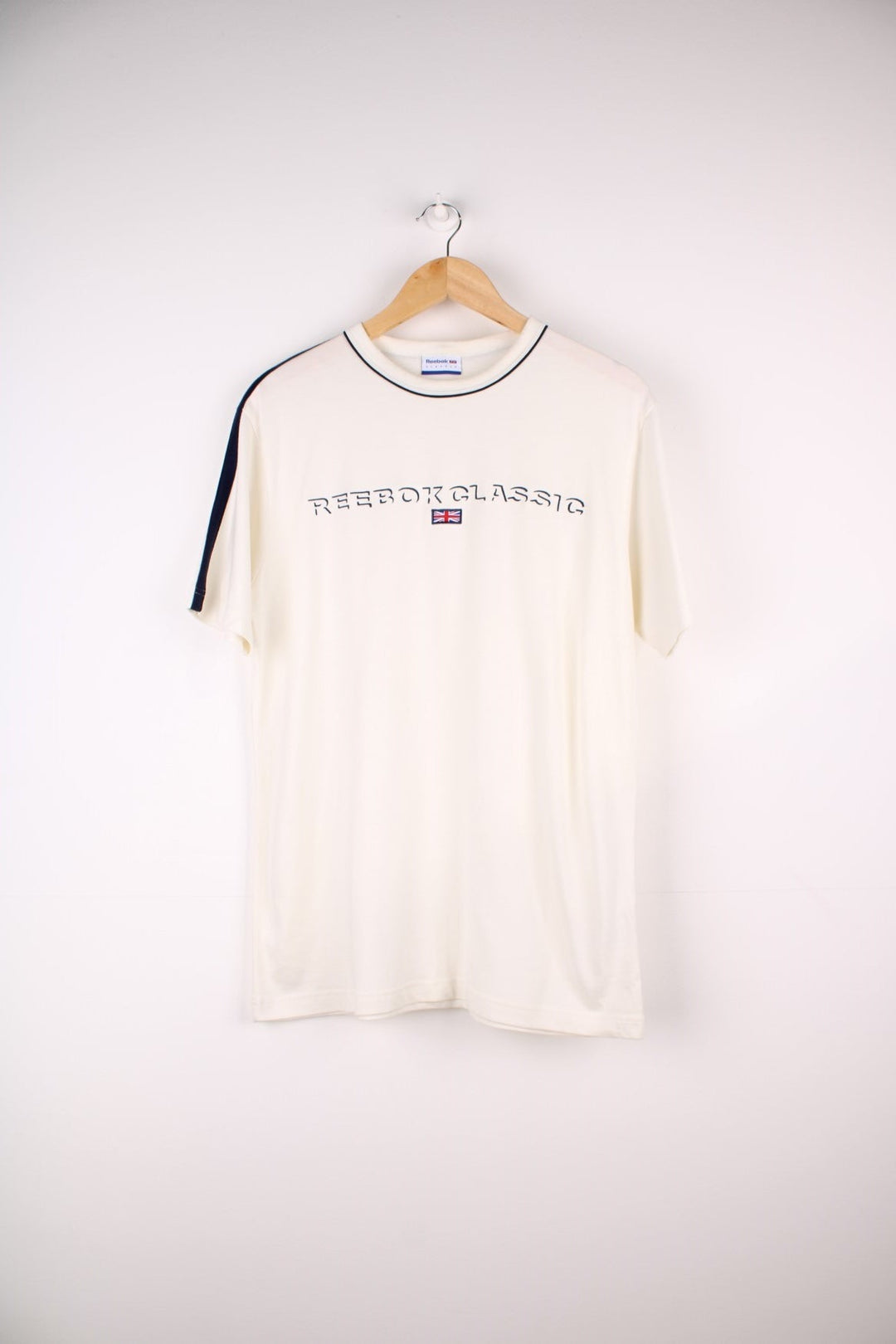 Reebok Classics T-Shirt in a tan colourway with the spell out logo embroidered across the front.