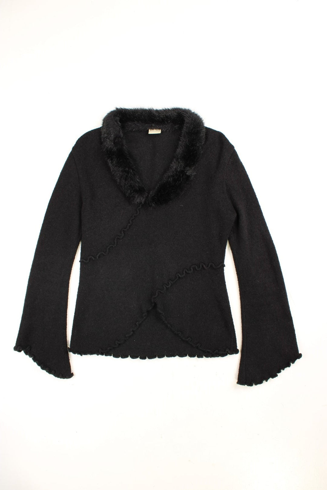 Y2K jumper by Escala in black with ruffle details, lettuce hems and cuffs, fluted sleeves, and a fluffy collar.