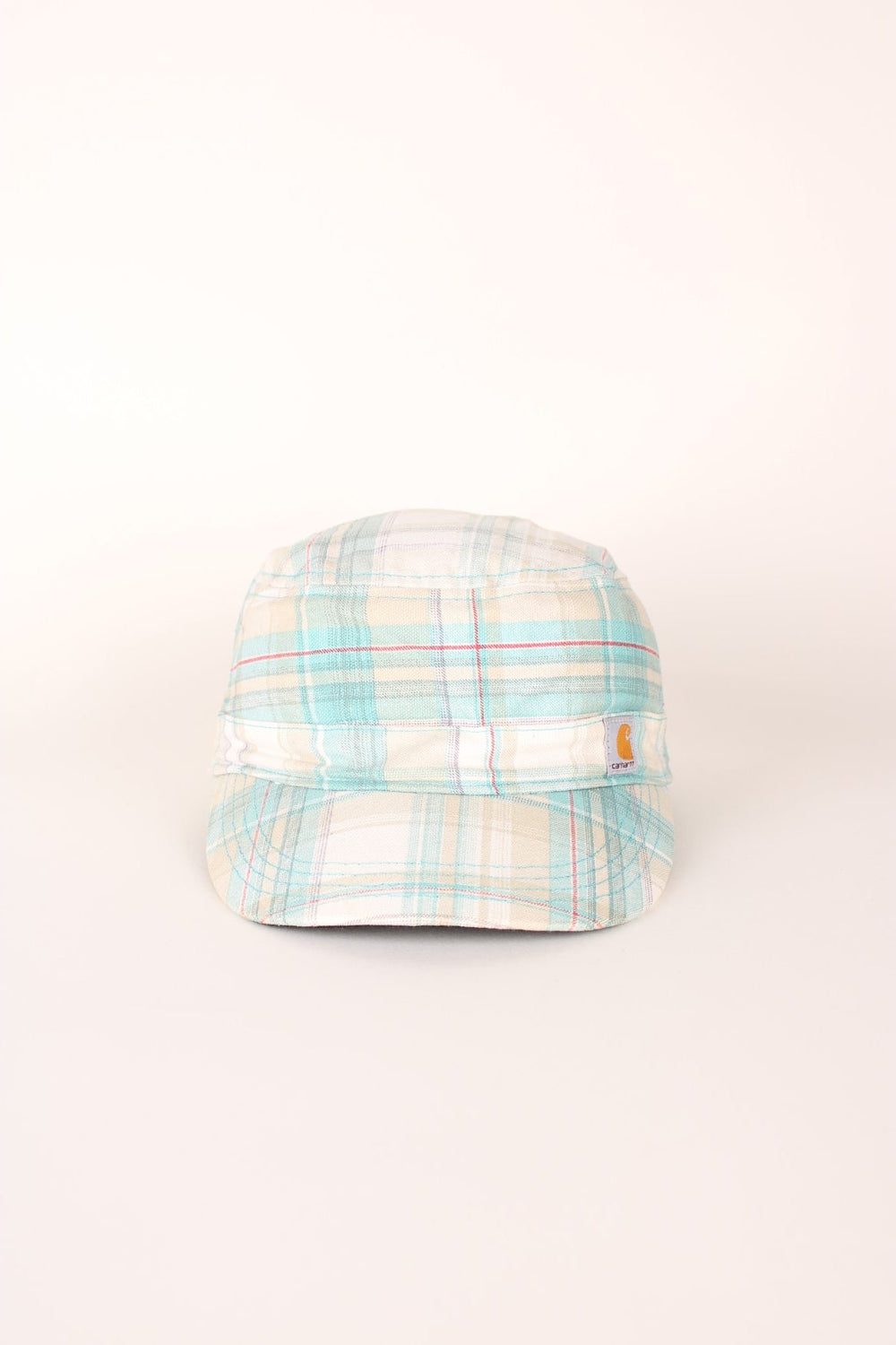 Carhartt El Paso Cap in a white, blue and red plaid colourway with the logo embroidered on the front and back, and has a adjustable velcro strap. 