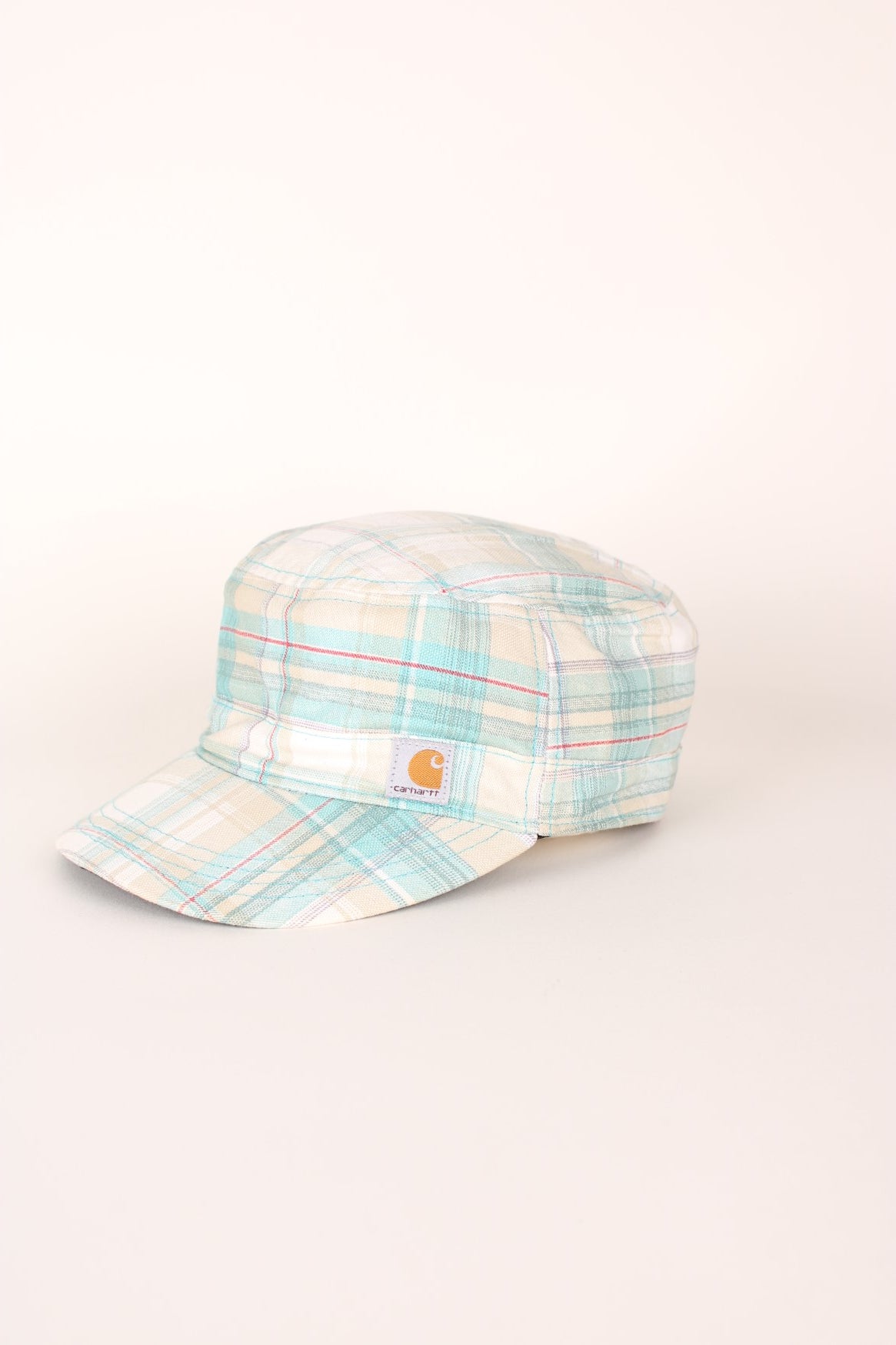 Carhartt El Paso Cap in a white, blue and red plaid colourway with the logo embroidered on the front and back, and has a adjustable velcro strap. 