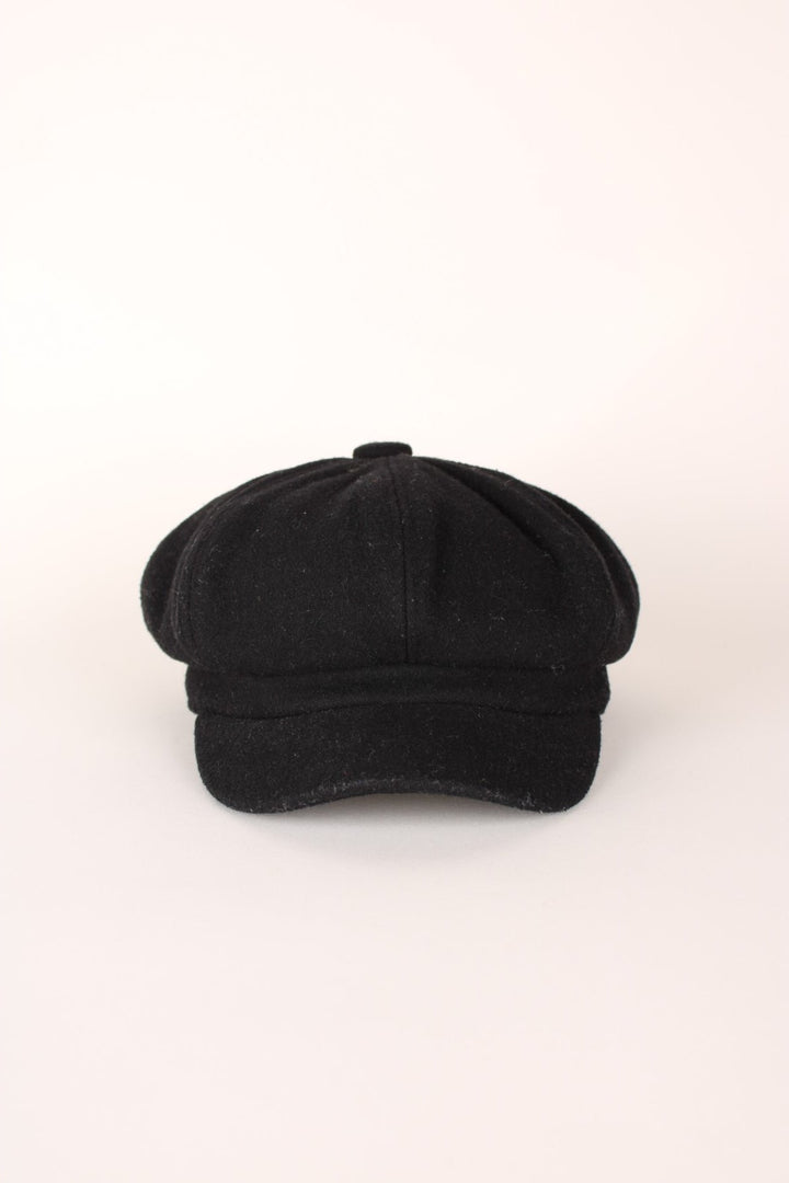 Vintage Baker Boy Hat in a black colourway and has an adjustable elasticated rim. 