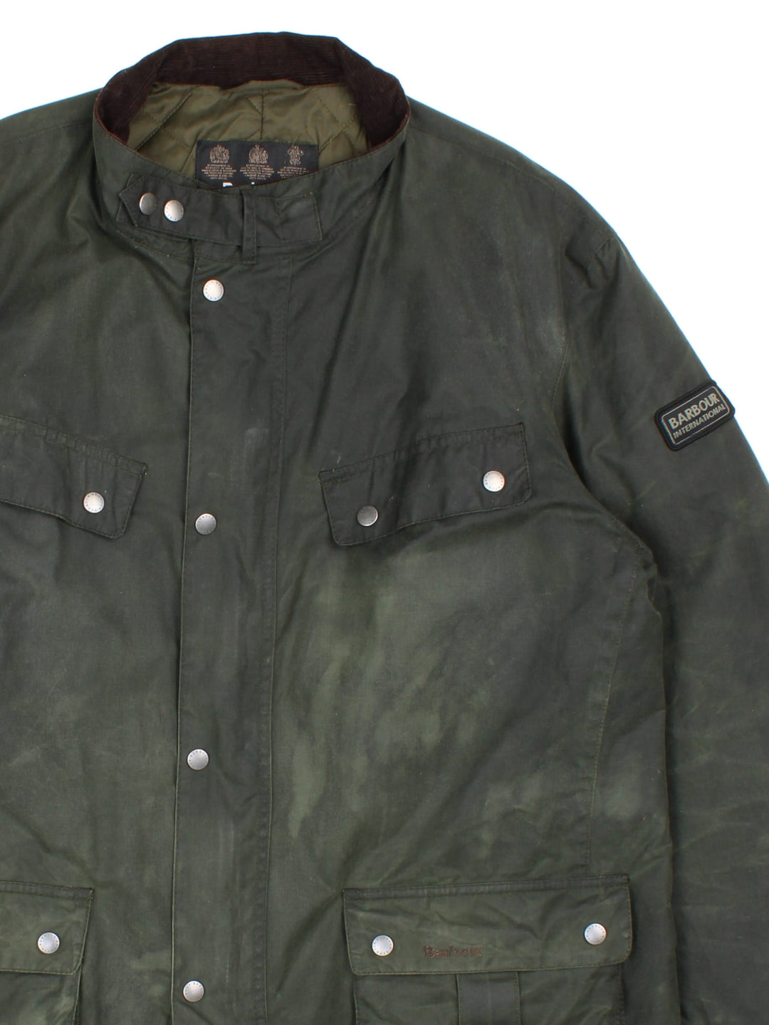 Barbour International Duke Jacket in a green colourway with a brown corduroy collar, zips and buttons up, has multiple pockets, insulated with a quilted lining, and has the logo embroidered on the front pocket and on the left slseeve.