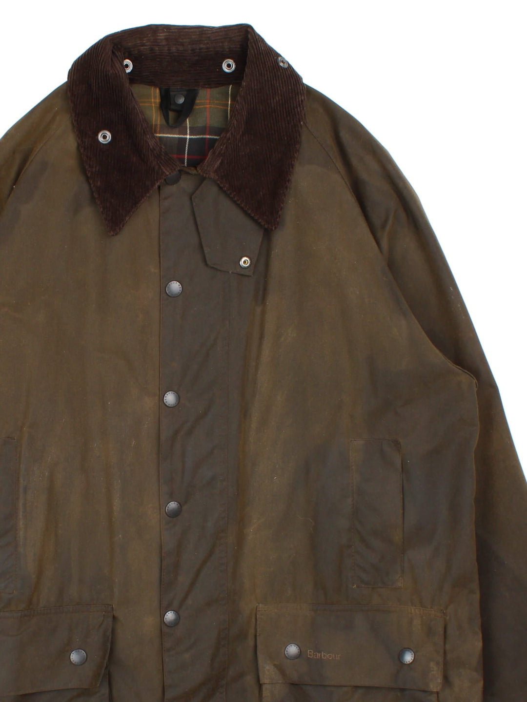 Barbour Beaufort Wax Jakcet in a green colourway, zips and buttons up, has multiple pockets, brown corduroy collar, and has the logo embroidered on the front pocket.