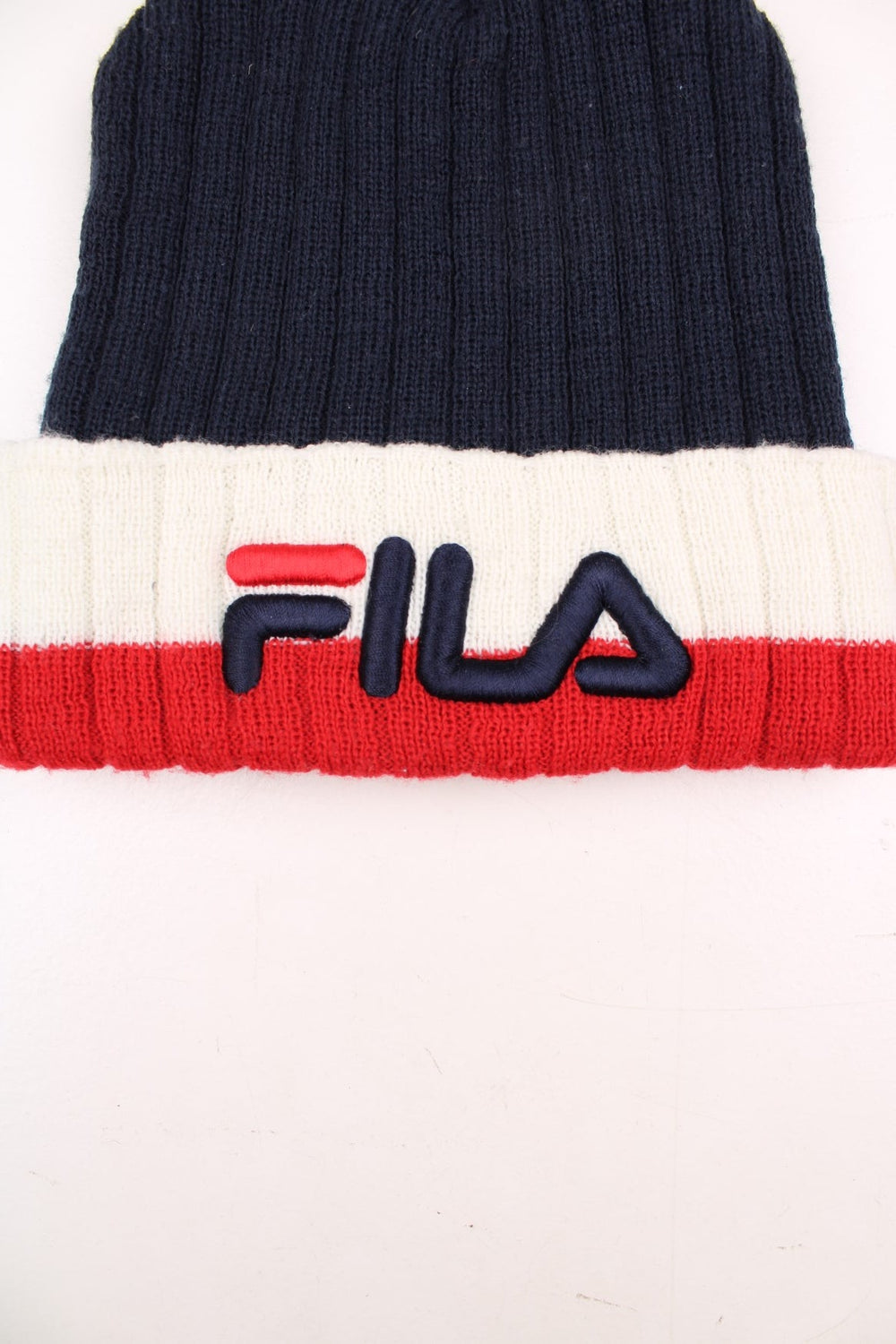 Fila red, white and blue beanie hat, features large embroidered spell-out branding on the front