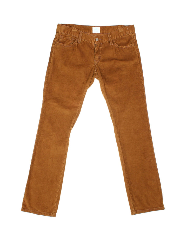 Levi Strauss white tab corduroy trousers in brown with four pockets, zip and button closure, and a white tab on the back.