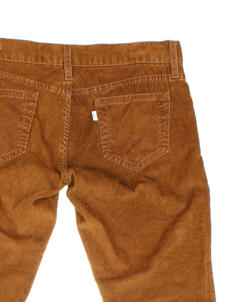 Levi Strauss white tab corduroy trousers in brown with four pockets, zip and button closure, and a white tab on the back.