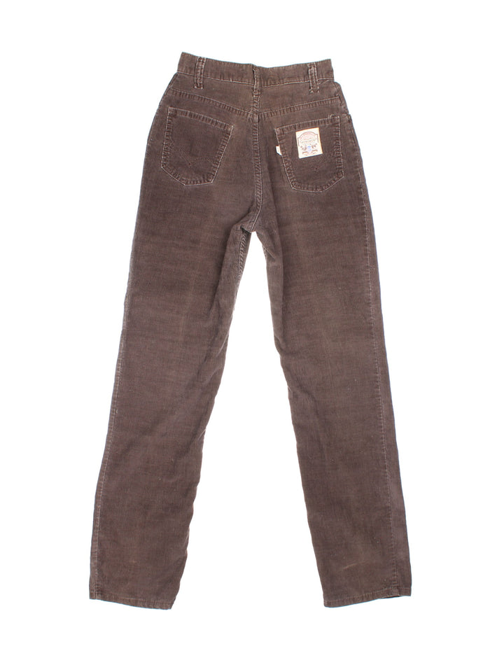 70s Levi Strauss white tab corduroy trousers in brown with four pockets, zip and button closure, and a logo patch on the back.