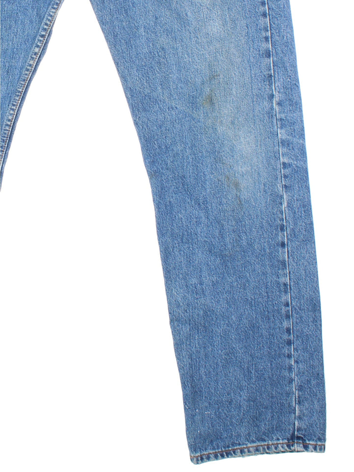 Levi Strauss 501 jeans in blue colourway with button up fly, straight leg and leather logo patch on the back.