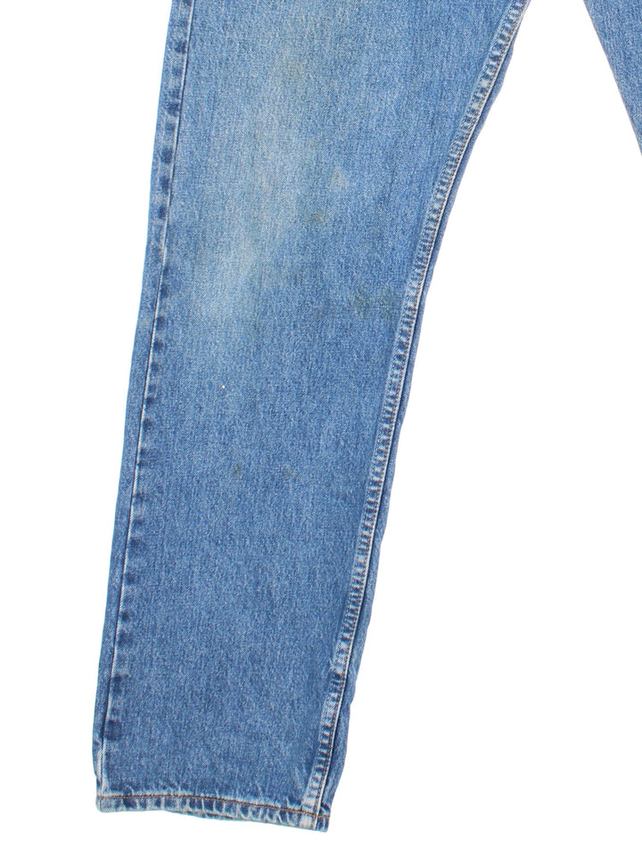 Levi Strauss 501 jeans in blue colourway with button up fly, straight leg and leather logo patch on the back.