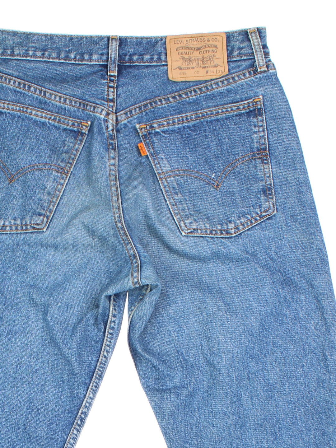 Levi Strauss 501 jeans in blue colourway with button up fly, straight leg and leather logo patch on the back.