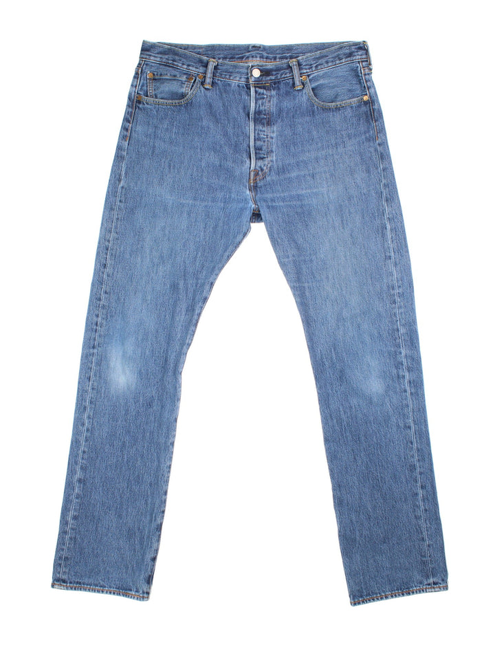 Levi Strauss 501 jeans in blue colourway with button up fly, straight leg and leather logo patch on the back.